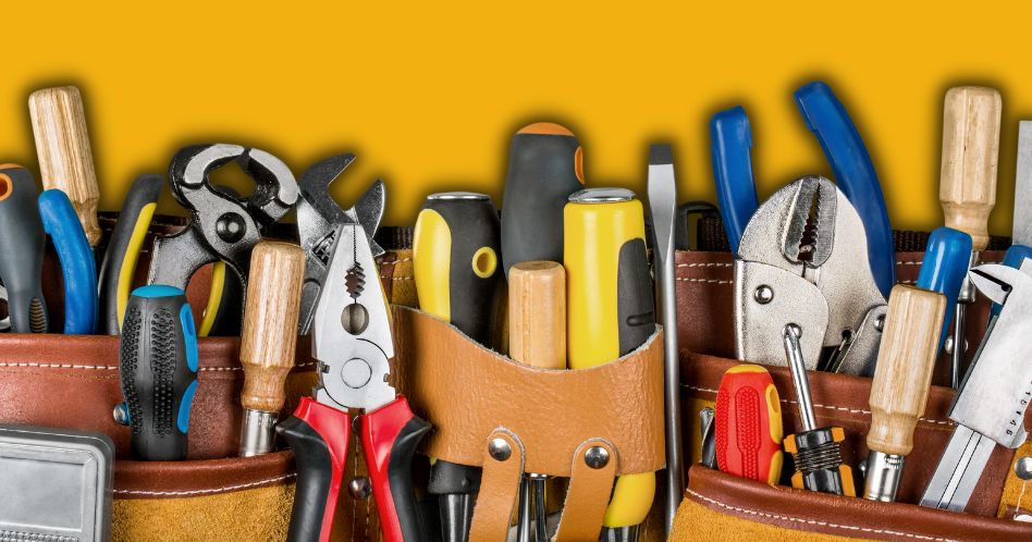 tools stuffed in work belt